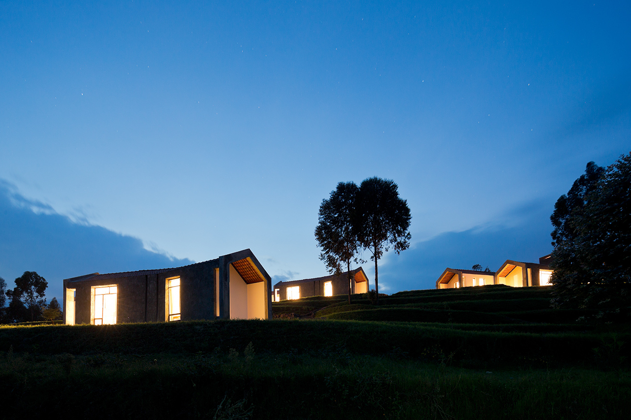 Photo of Butaro Doctors' Housing, Photo by Iwan Baan, Nightime Exterior View of the Housing and Landscape
