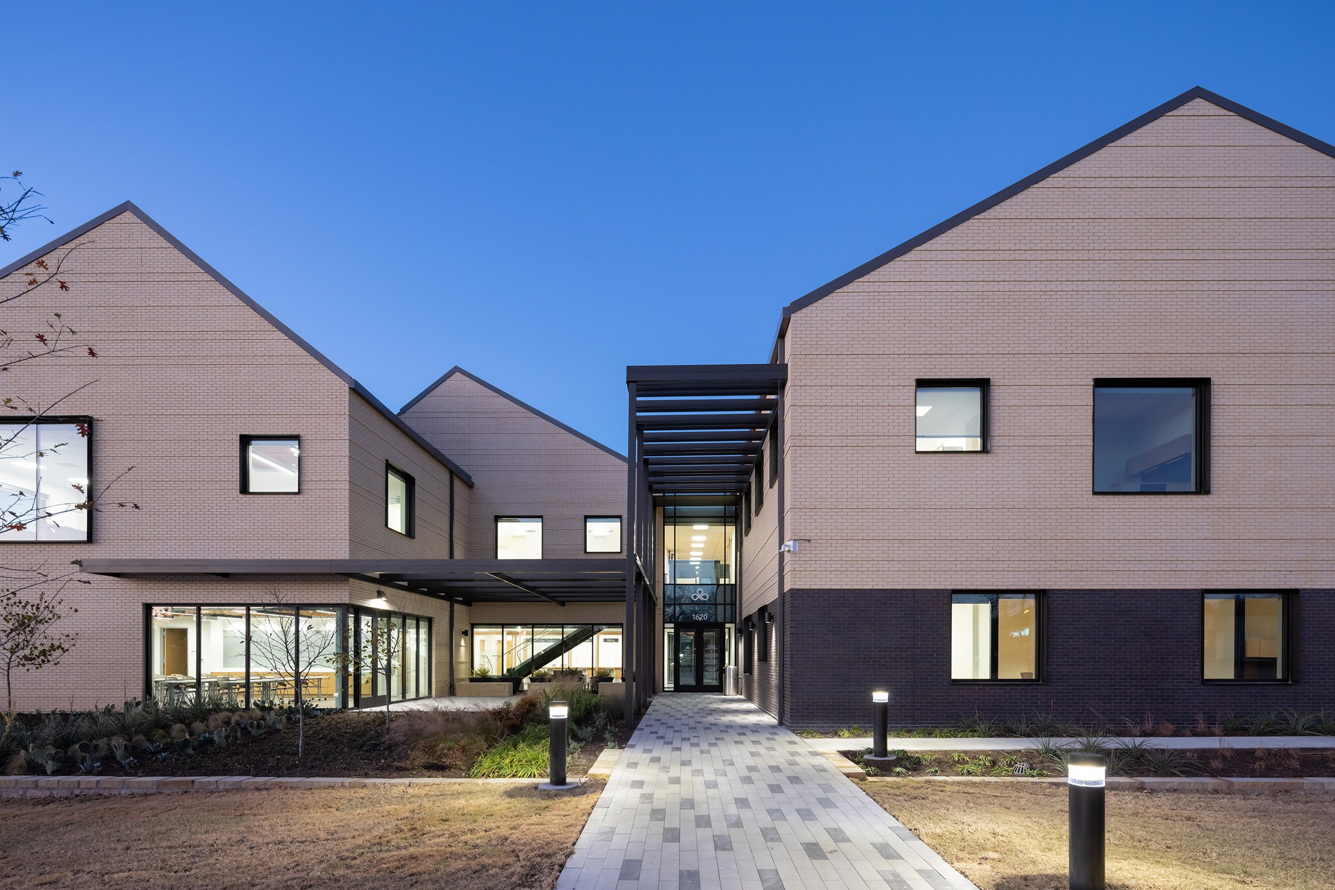 Exterior of the health center's entry at sunset