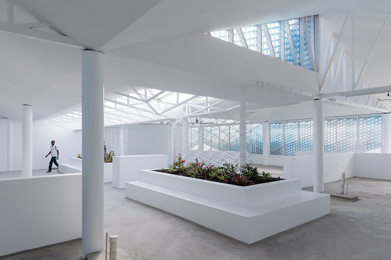 Photo of Gheskio Cholera Treatment Center, Photo by Iwan Baan, Interior Atrium with Skylights Doctor Walking in the Hallway
