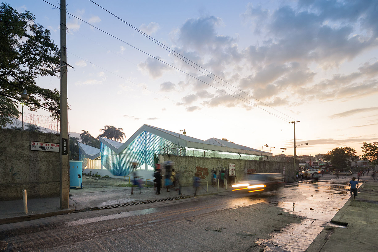 Photo of Gheskio Cholera Treatment Center, Photo by Iwan Baan, Exterior Nighttime View of Port-au-Prince Street and Building Facade