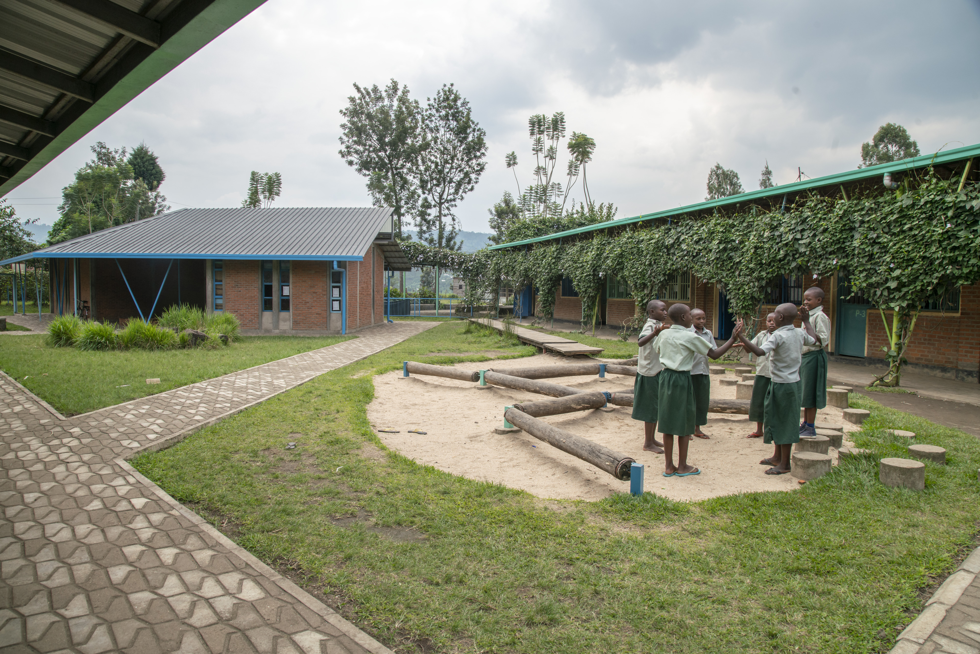 Photo of Mubuga Primary School, children gather in the inner yard