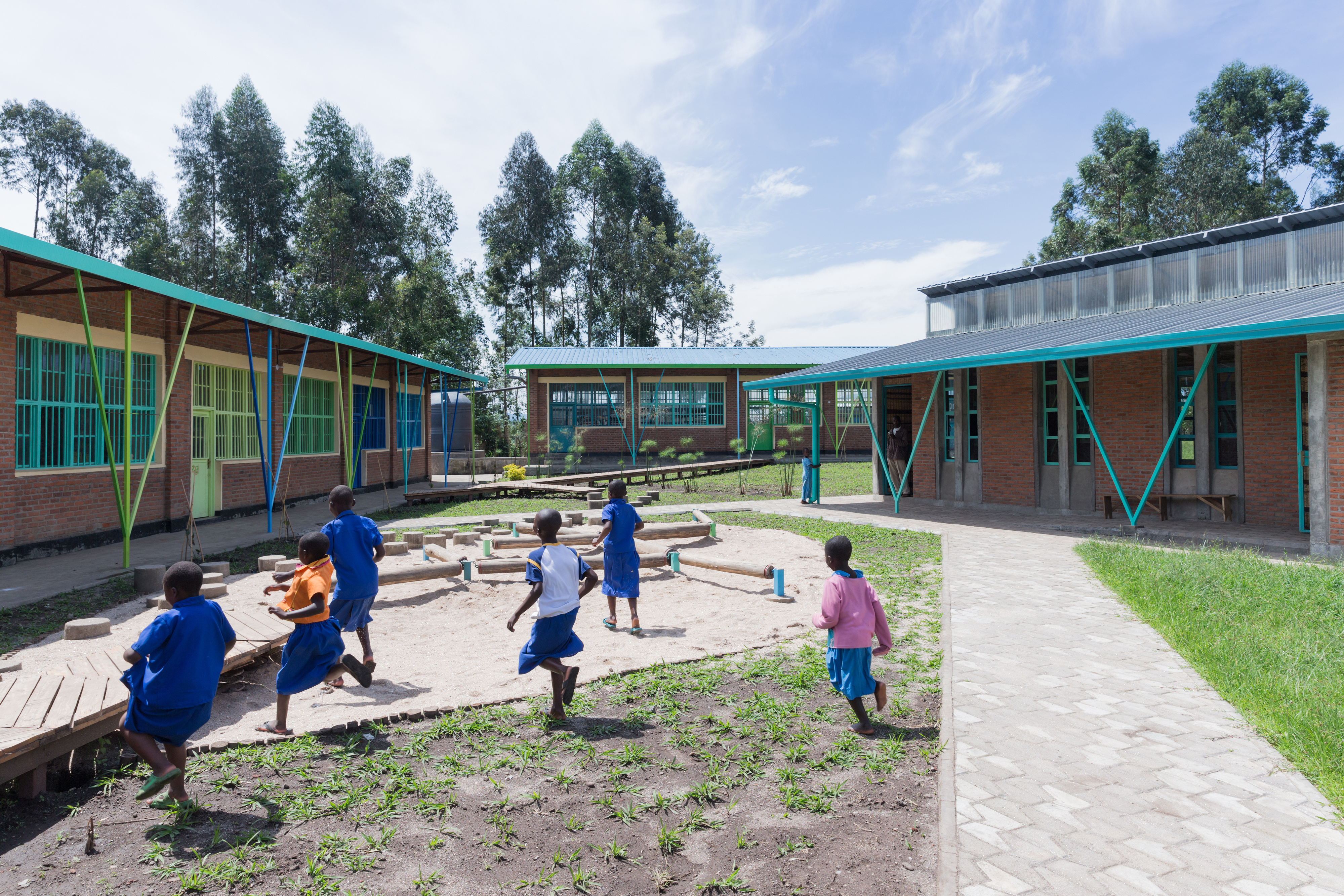 Photo of Mubuga Primary School, Photo by Iwan Baan, children playing in the inner yard of the school
