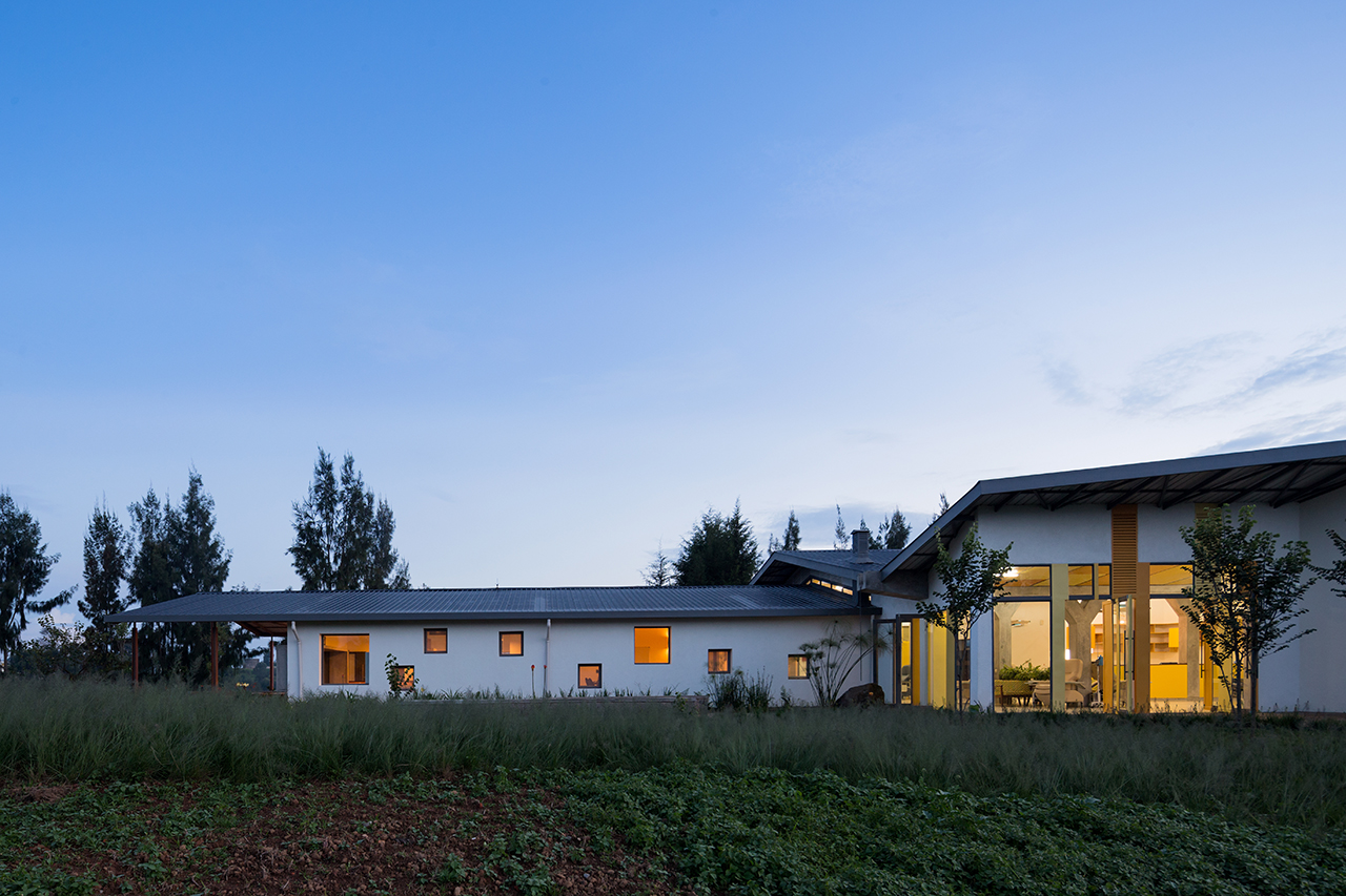 Photo of Butaro Ambulatory Cancer Center, Photo by Iwan Baan, Totality of the Building Exterior Nighttime View